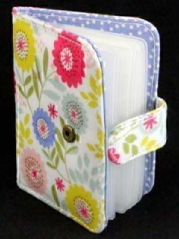 Wipe clean PVC multi card wallet in Floral Song design by Gisela Graham. Lined with a cotton lining, in a lilac with white dots design. Holds 20 credit card sized cards. Would make a great gift for the a lady or girl. 9.5x11.5x2cm